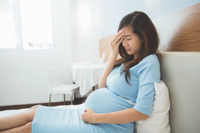 pregnant woman experiencing light bleeding