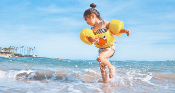 Kid at the beach, one of many family-friendly places in Singapore.