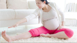 a pregnant asian woman exercises while pregnant