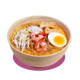 Bowl of laksa with noodles in spicy coconut broth, topped with prawns, bean sprouts, fish cake slices, and half a boiled egg.