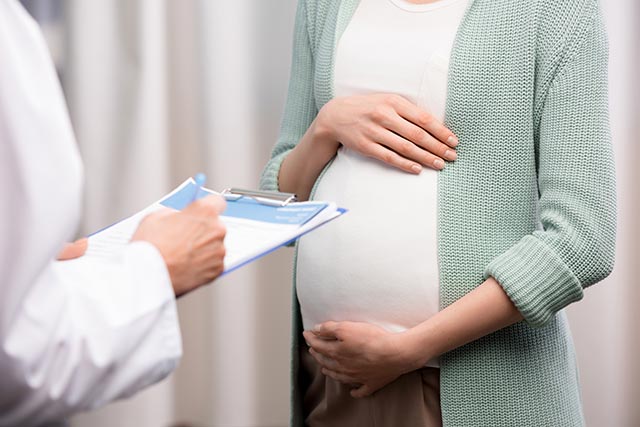 Pregnant mother visiting the doctor's for her appointment