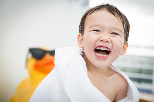 Young boy having fun in a water park