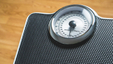 Weighing scale. Some people worry about weight gain after starting a smoking cessation programme.