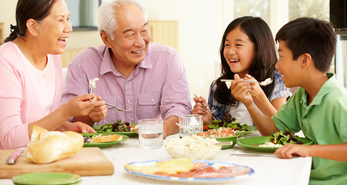 Asian family eating a meal together