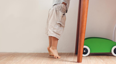 toddler-child-tiptoeing-at-home.jpg
