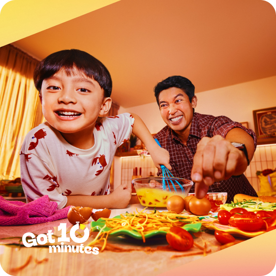 Father and daughter preparing a healthy meal together.