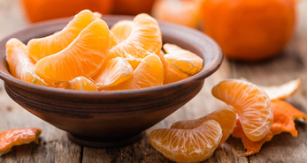 A bowl of peeled mandarin oranges without the rind