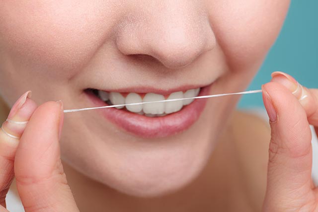 Maintain your oral health with regular flossing. 