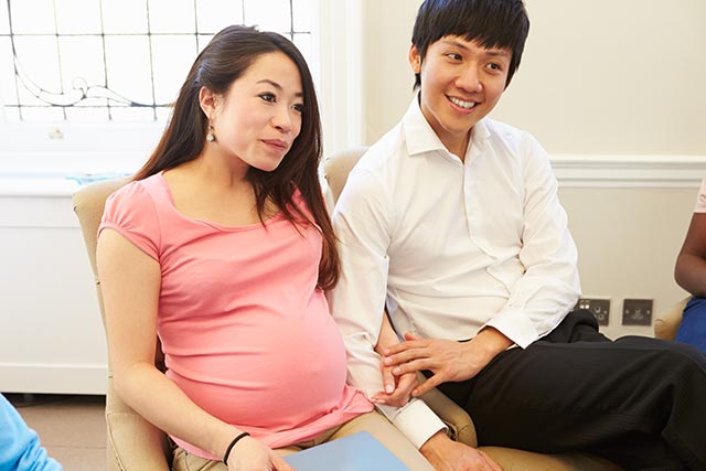 Asian couple visiting ante-natal class together