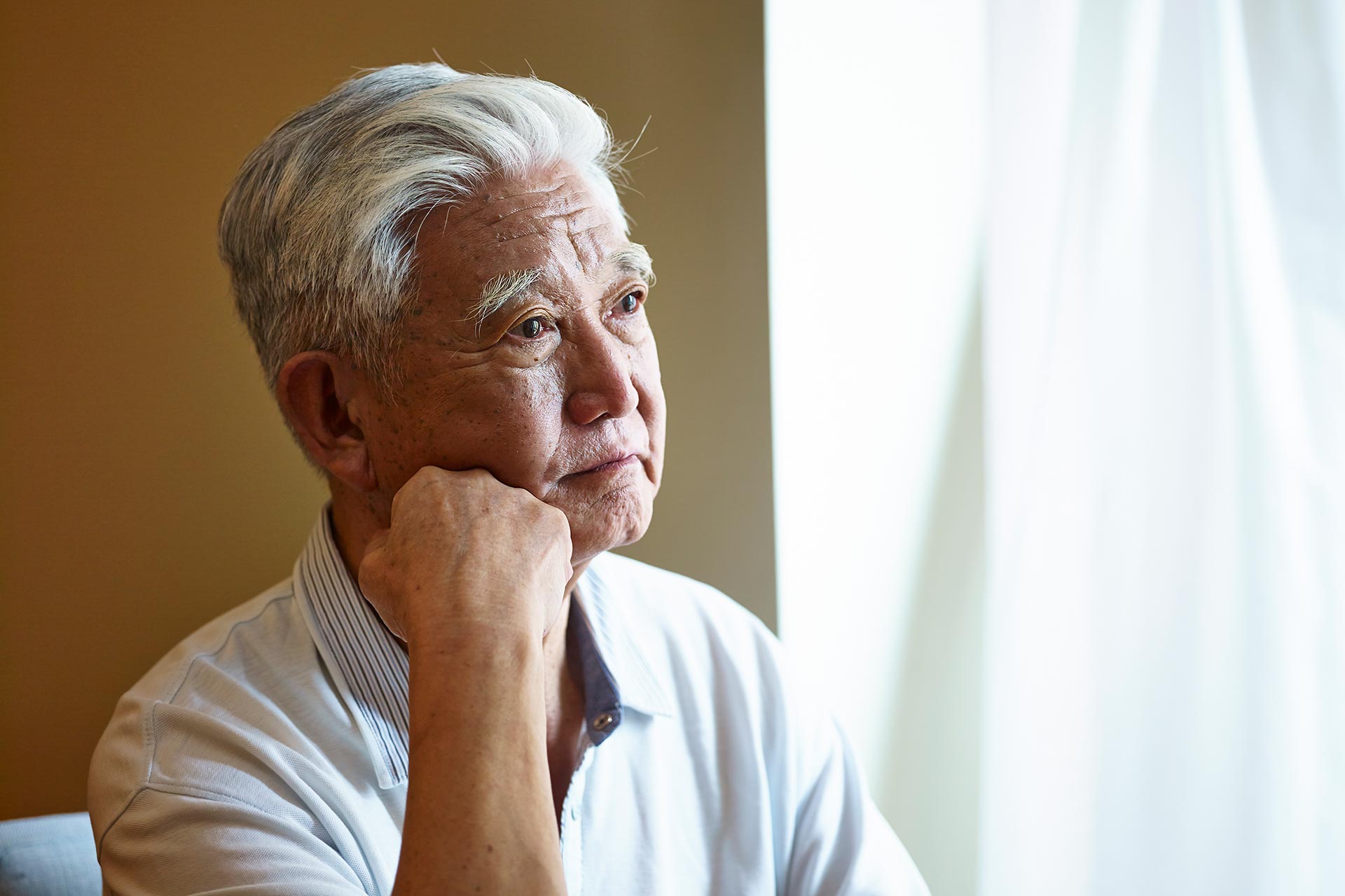 portrait-of-a-sad-senior-asian-man.jpg