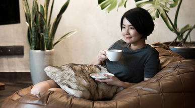 young-woman-drinking-coffee-at-home.jpg