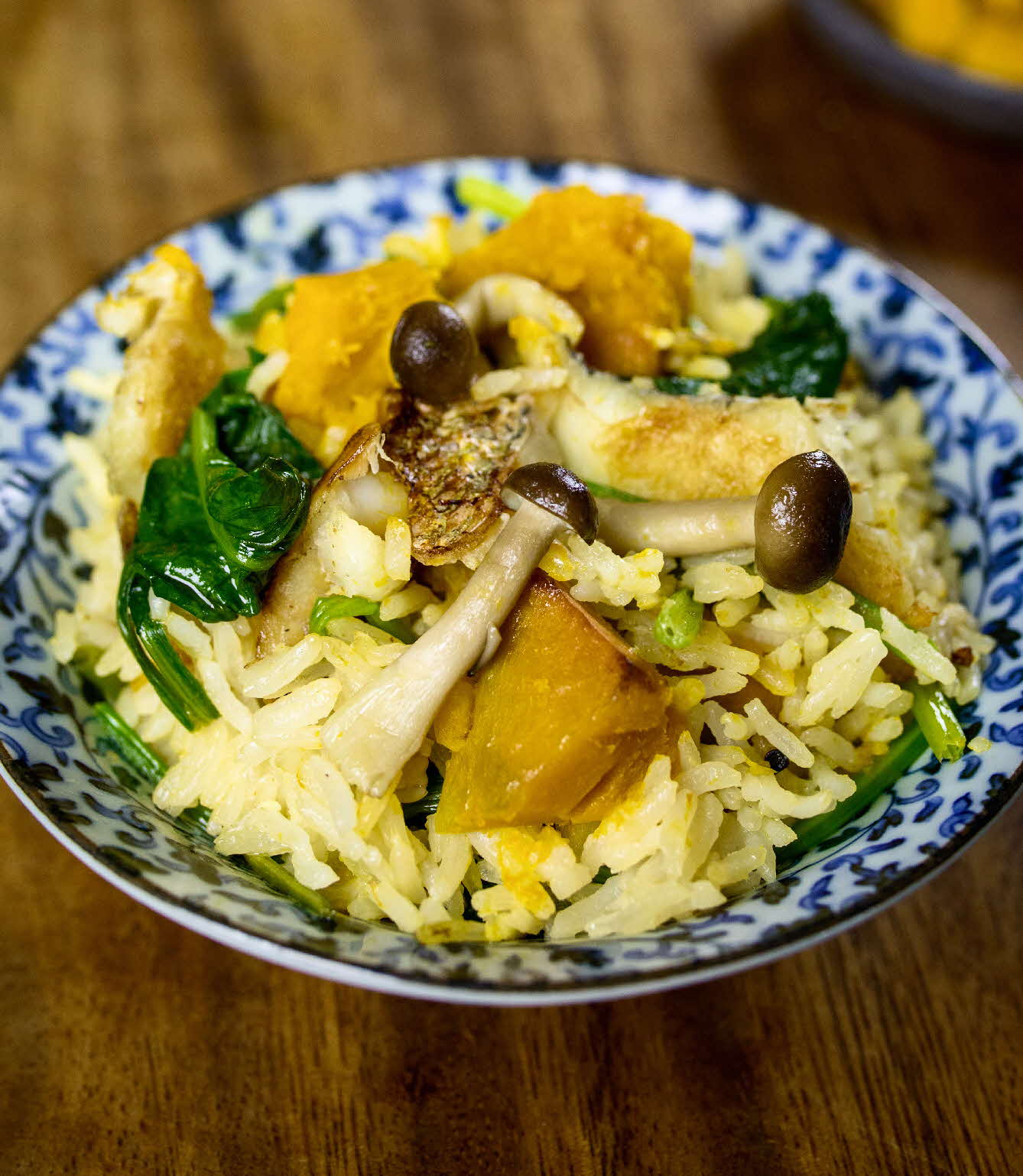 One pot pumpkin mushroom rice with white fish and spinach.