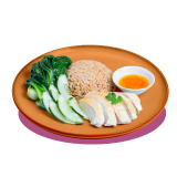 Plate of poached chicken with brown rice, leafy greens, and a side of dipping sauce.