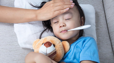 asian-chinese-mother-measuring-little-girl-forehead-for-fever.jpg