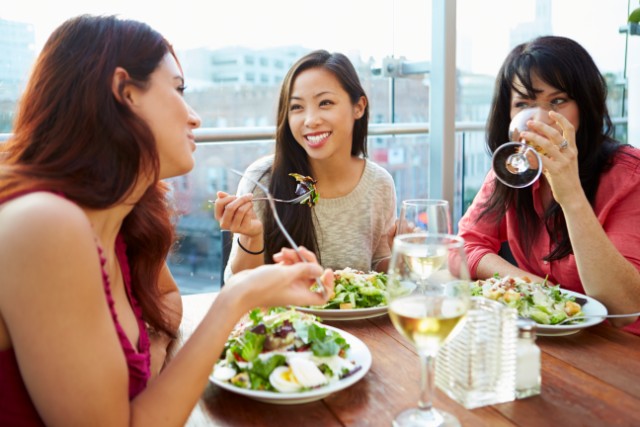 A group of friends eating healthy food during the holidays