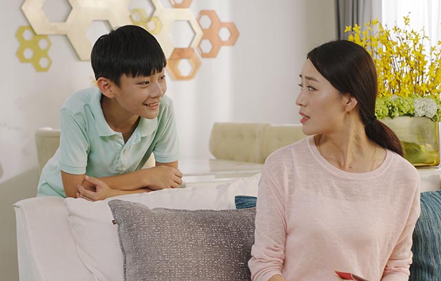 Mother and song talking in the living room