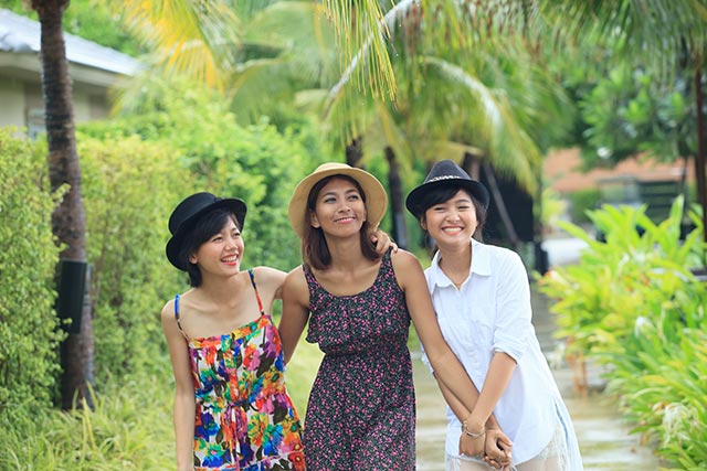 Group of young people taking a walk in the park.