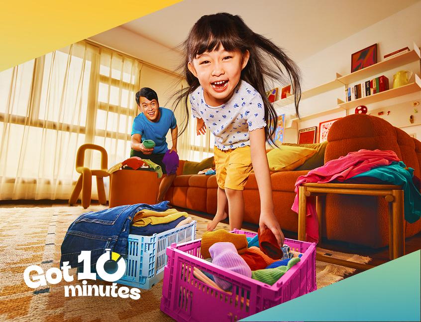 Child playing actively at home with a family member.