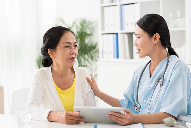 Elderly lady talking to the docter about her problems