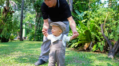 Opmz_Asian-toddler-boy-walking-with-his-father,-Baby-first-step-concept-689233904.jpg