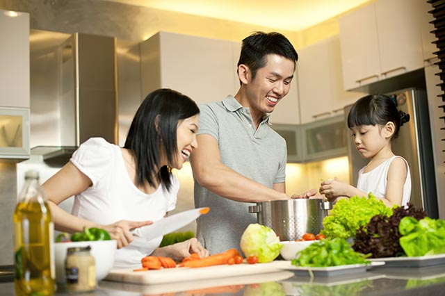 Asian Family Preparing Food