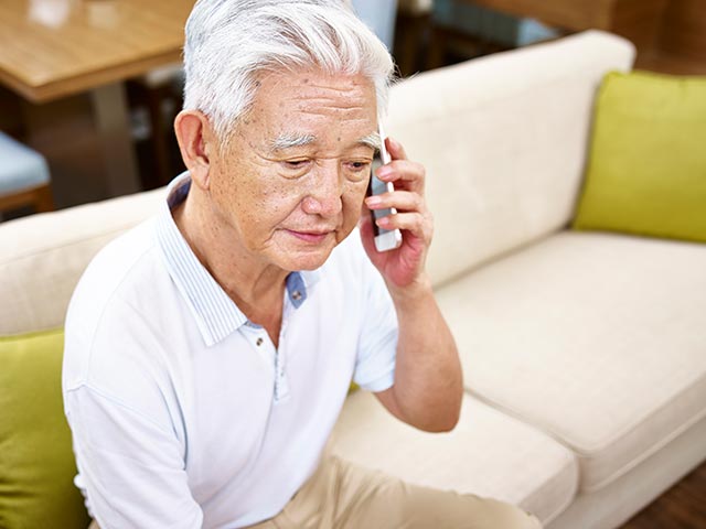 A senior talking on the phone