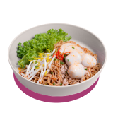 Bowl of noodles topped with fish balls, bean sprouts, shredded vegetables, and lettuce.