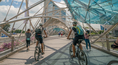 cyclist-riding-on-helix-bridge-in-marina-bay-singapore.jpg