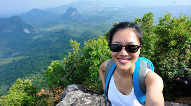hiking-woman-taking-photo-with-smart-phone-on-mountain-peak.jpg
