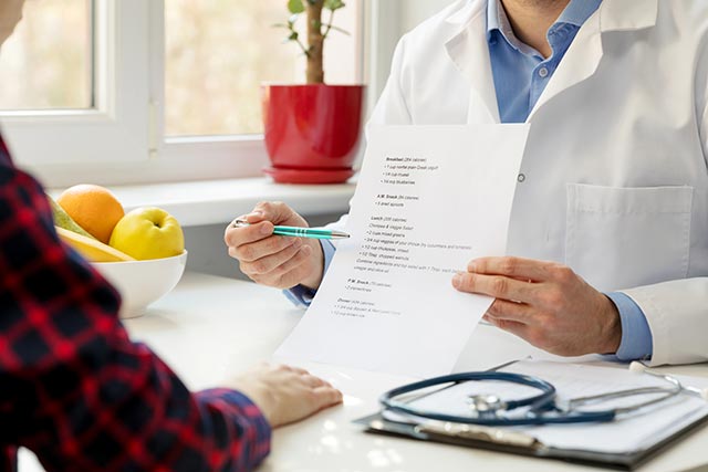 Asian woman discuss with her doctor