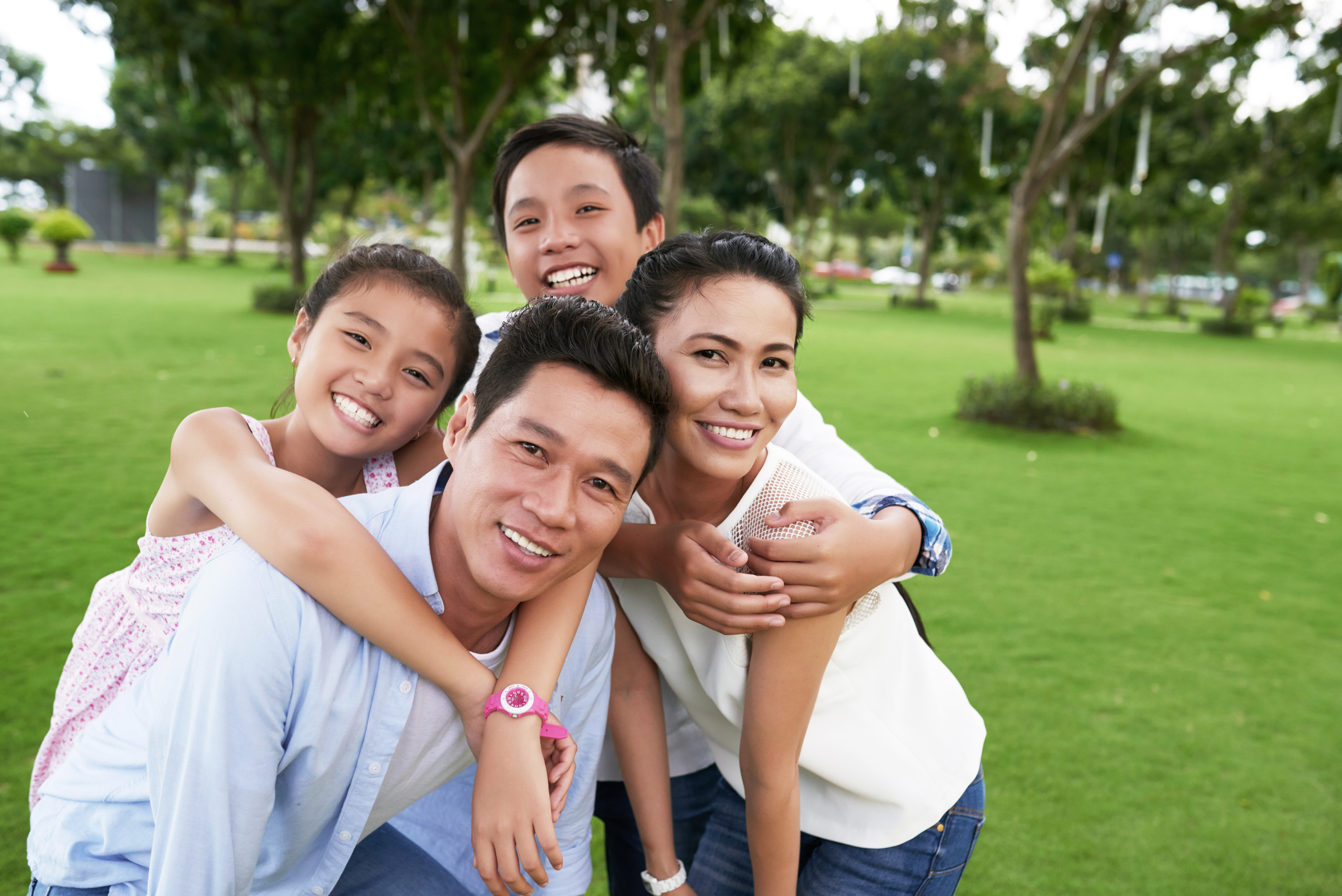 Five young child taking a group photo happily