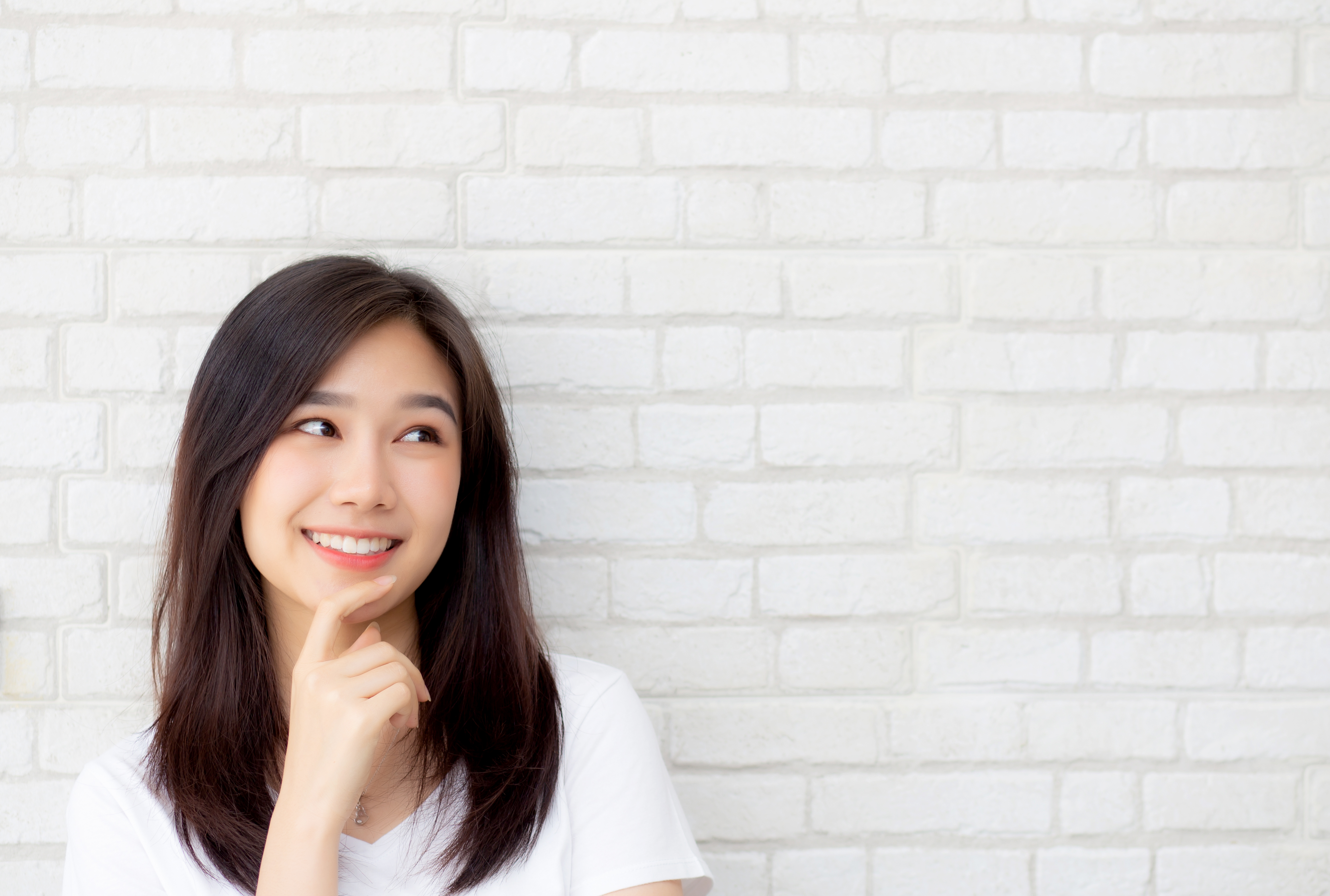 Young woman thinking about how she can improve her self-esteem.