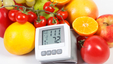 blood-pressure-monitor-and-fresh-ripe-fruits-with-vegetables-healthy-lifestyle
