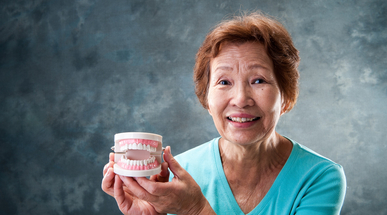 CGH - Good oral care for patients_Elderly woman holds teeth.jpg