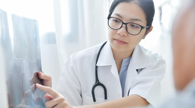 young-female-doctor-examining-x-ray-film.jpg