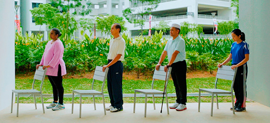 Stand tall beside a chair, with feet shoulder-width apart. Hold onto the back of the chair for support if required.