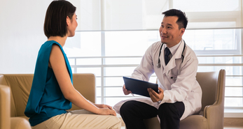 Doctor talking to his patient about getting vaccinations