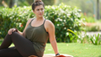 Young woman practicing yoga in the park