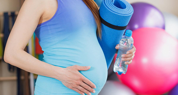 Pregnant woman going for prenatal yoga classes