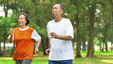 Older adults running in the park to reap the benefits of exercising.