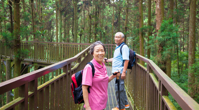 happy-senior-hiking-in-the-forest-park.jpg