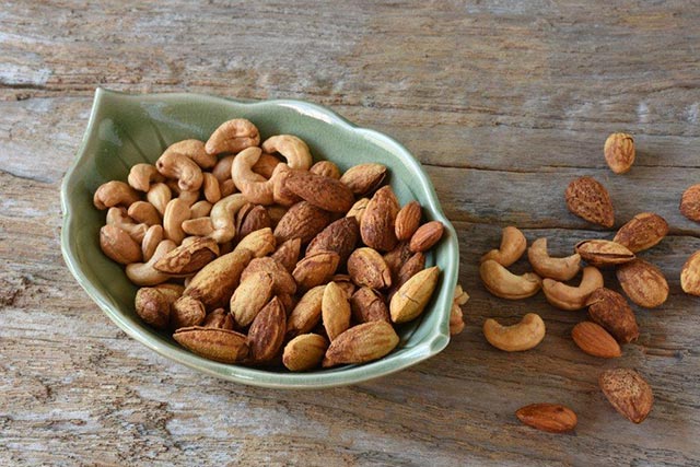 Bowl of nuts on a wooden table