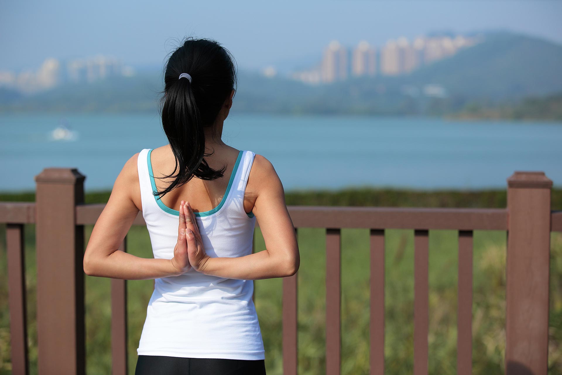 young-woman-doing-yoga-exercises-in-the-city-park.jpg