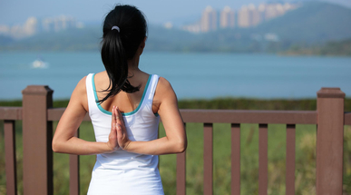 young-woman-doing-yoga-exercises-in-the-city-park.jpg