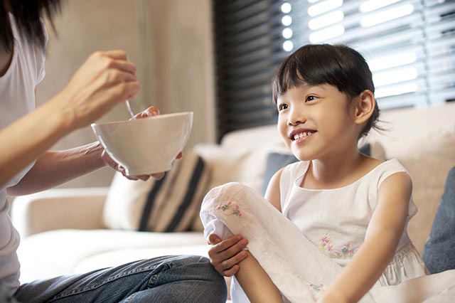 Young girl getting a single serving of a healthy meal to meet her daily nutritional needs and foster proper growth and development