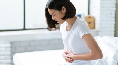 Asian-women-stomach-ache.jpg