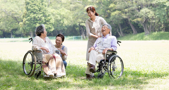 caregivers with their elderlys at the park