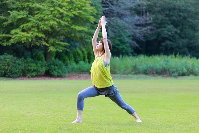 The warrior pose is one of the standing exercises you can do at work