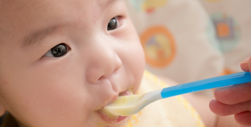 Feeding rice shop to baby