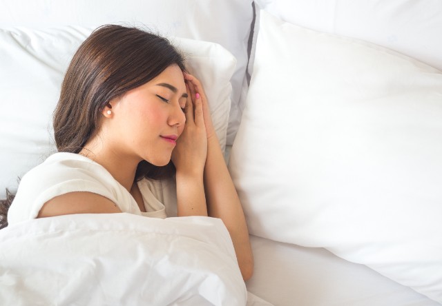 Young woman getting healthy sleep.